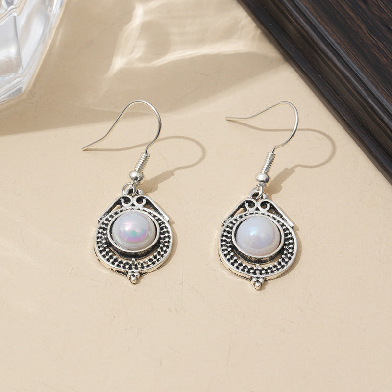 Silver Womens Drop Earrings With A Rotating Droplet Design