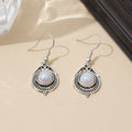 Silver Womens Drop Earrings With A Rotating Droplet Design